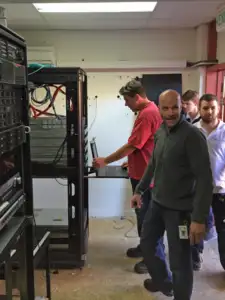 men shutting down servers
